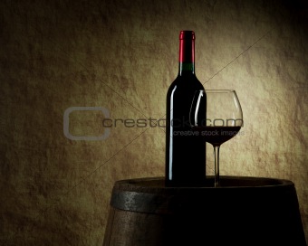 red wine, bottle, glass and old barrel