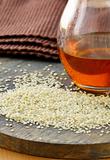 sesame seeds and sesame oil in a bottle