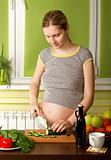 pregnant woman on kitchen