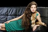 young elegant girl in green with fur