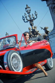 Happy smiling woman in a car. Romantic in Paris.