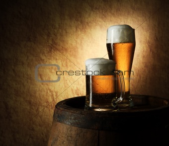 Still Life of beer and barrel on a old stone