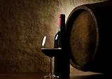Red wine, bottle, glass and old barrel