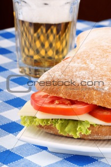 Italian panino sandwich and beer