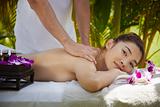 Happy asian woman smiling during massage in spa