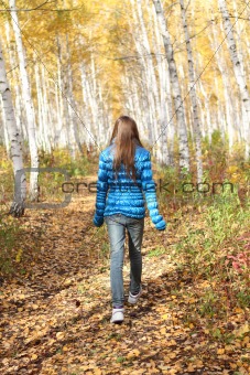 Lonely teenage girl in the autumn 