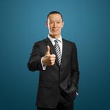 asian businessman in black suit shows well done