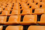 Orange Empty plastic seats at stadium