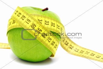 Green apple and measuring tape