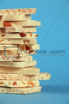 White chocolate stack on blue background