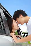 romantic couple looking at each other in the car