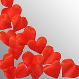 Petals in heart shape over gray background - frame. Clipping path included.