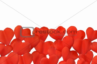 Petals in heart shape over white background - frame. Clipping path included.