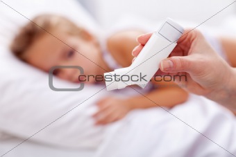 Sick kid with inhaler in foreground
