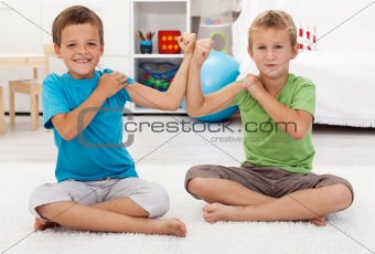 Boys showing their biceps