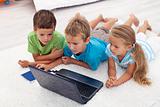Kids looking at laptop computer
