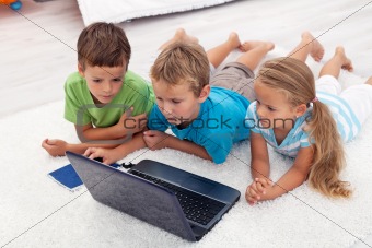 Kids looking at laptop computer