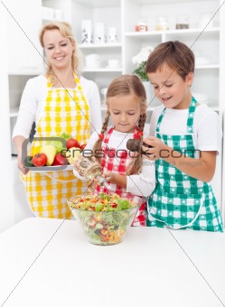 Kids preparing a healthy fresh salad
