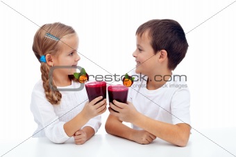 Kids clinking with fresh juice