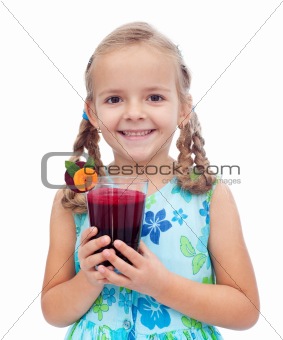 Happy healthy little girl with fresh juice