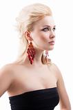 red earring on cute blond girl, she has searious expression