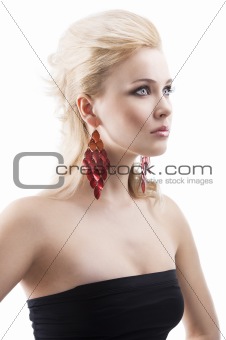 red earring on cute blond girl, she has searious expression