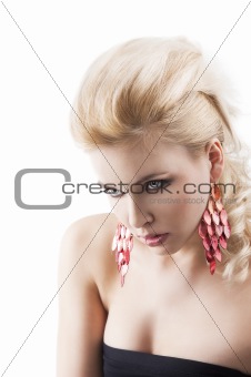 red earring on cute blond girl, bent head and actractive express