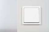 white light switch on the wall