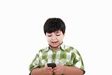 Boy text messaging isolated over white 