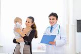 Mother and baby on examination at pediatricians cabinet

