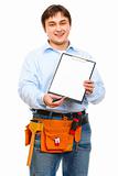 Construction worker giving clipboard and pen for signing
