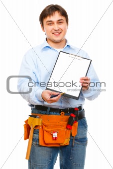 Construction worker giving clipboard and pen for signing
