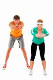 Fit young woman and man in sportswear making sport exercise isolated on white
