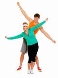 Fit girl and man in sportswear having fun isolated on white
