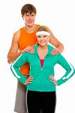 Portrait of happy young man and fitness girl in sportswear isolated on white
