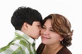 little boy kiss his mother on a white background 