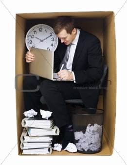 Businessman in a tight office