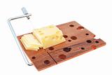 Wooden cutting board with cheese slices