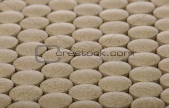 closeup background of brown pills