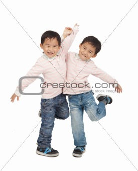happy asian boys dancing together