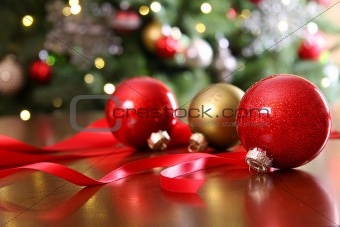 Red Christmas ornaments on a table