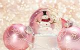 Snow globe with pink ornaments