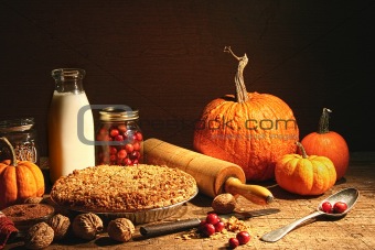 Still life of autumn fruits and and crumble pie