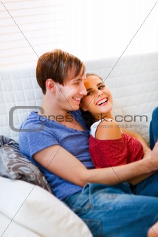 Romantic young couple in love enjoying themselves at home
