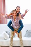 Cheerful young couple having fun at home
