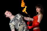 Young woman with a gas torch and scared man