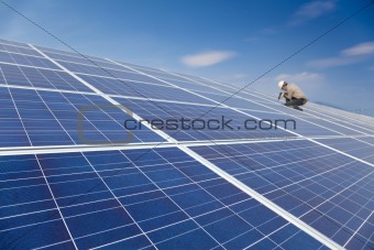 close up solar panel and professional worker installing photovoltaic solar panels