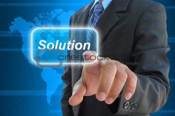 businessman hand pushing solution button on a touch screen interface