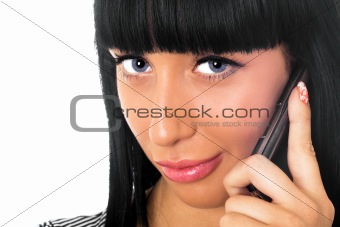 Portrait of the beautiful girl speaking on the phone