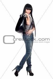 Pretty girl with a handbag. Isolated on white